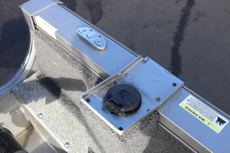 Slide: The Image of 2017 Lowe Fish & Ski 175 boat detail with latch and warning label. - 17