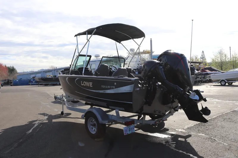 Slide: The Image of 2017 Lowe Fish & Ski 175 boat on trailer in outdoor setting. - 19