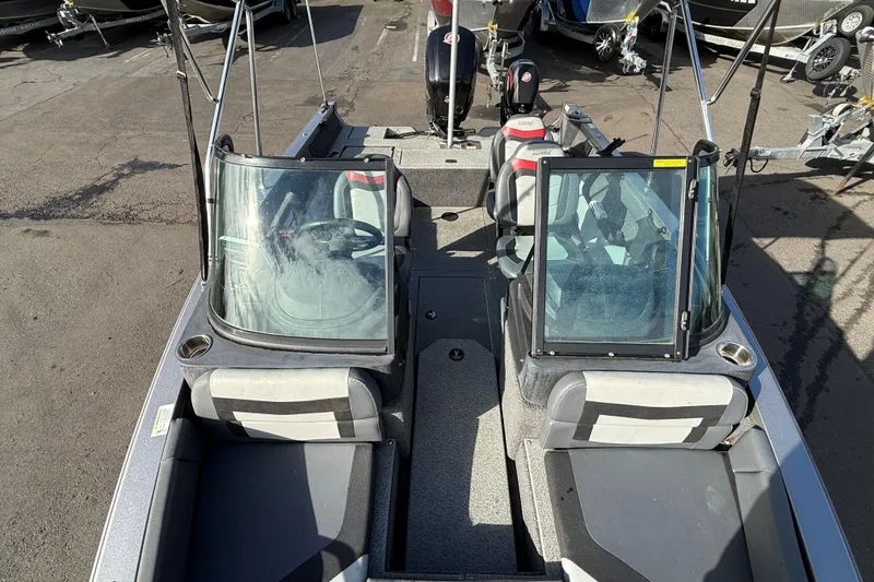 Slide: The Image of 2017 Lowe Fish & Ski 175 boat interior with dual consoles and seating. - 5