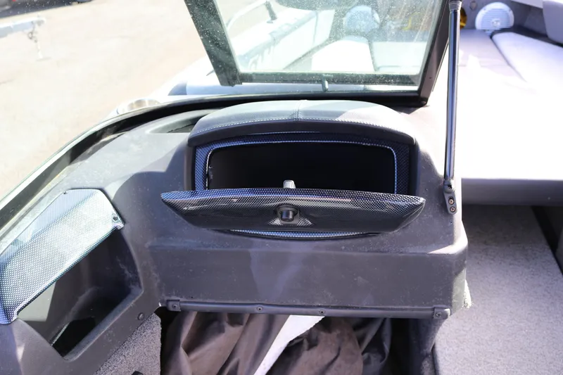 Slide: The Image of 2017 Lowe Fish & Ski 175 boat dashboard with open glove compartment. - 9