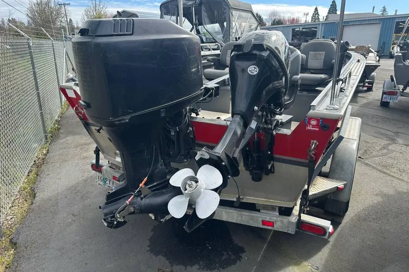 Slide: The Image of 1992 Alumaweld Super Vee Mechanic's Special boat with dual outboard motors on trailer. - 3