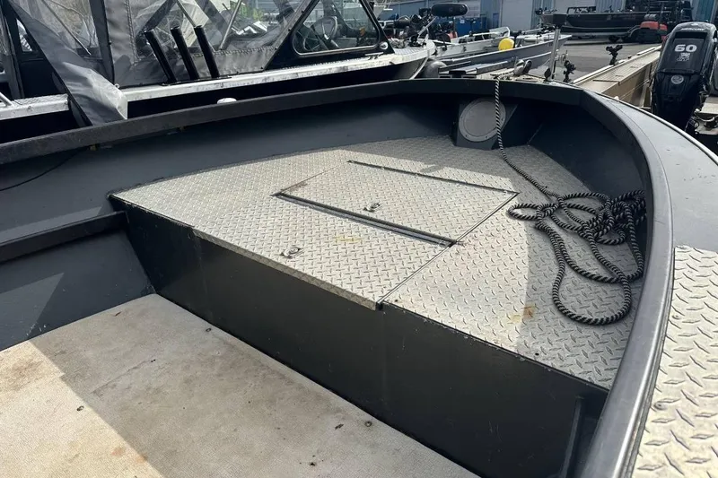 Slide: The Image of 1992 Alumaweld Super Vee Mechanic's Special boat deck with diamond plate flooring. - 7