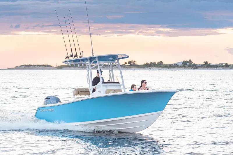 Slide: The Image of Manufacturer Provided Image: 2022 Sportsman Open 212 Center Console boat cruising on water at sunset. - 14