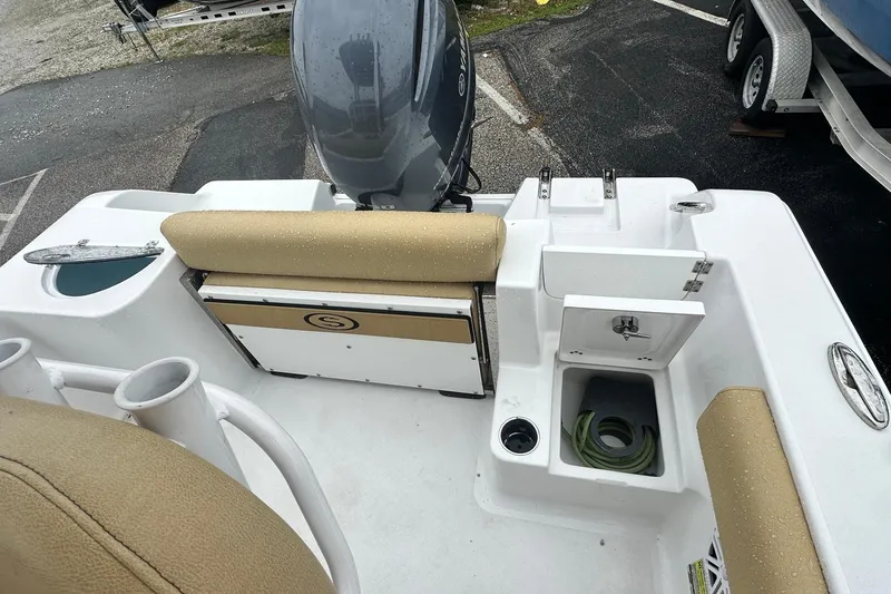 Slide: The Image of 2022 Sportsman Open 212 Center Console boat interior with seating and storage compartments. - 17