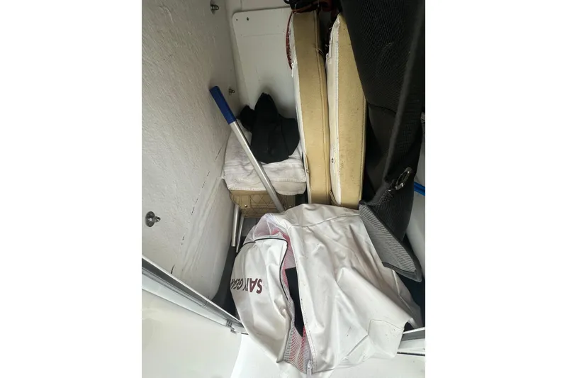 Slide: The Image of Storage compartment of 2022 Sportsman Open 212 Center Console with gear and equipment. - 20