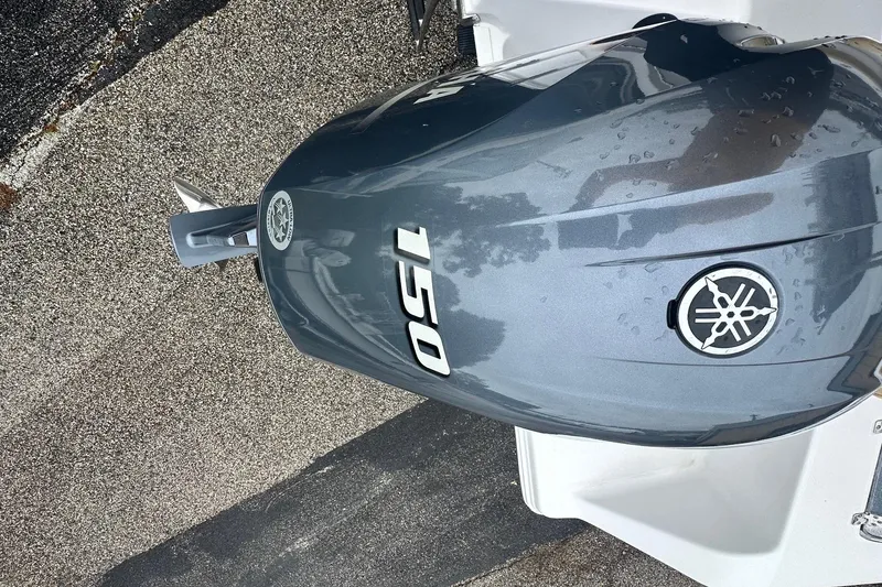 Slide: The Image of Yamaha 150 outboard motor on a 2022 Sportsman Open 212 Center Console boat. - 9