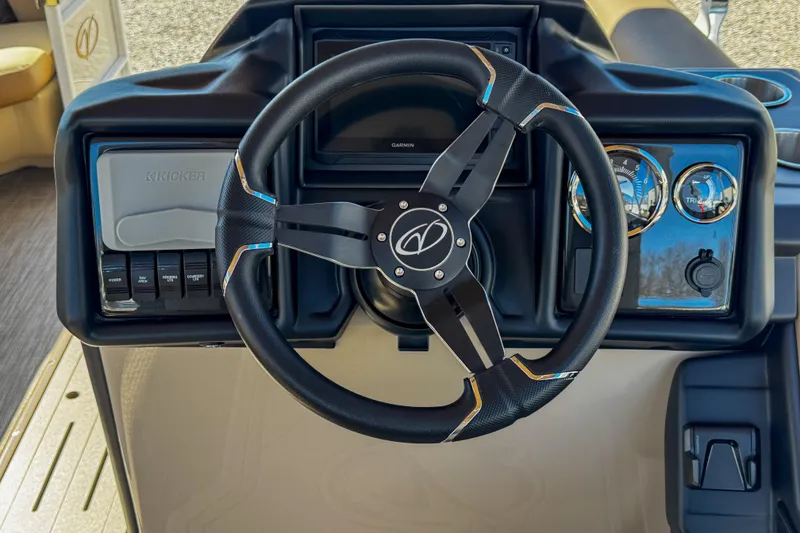 Slide: The Image of Steering wheel and dashboard of 2026 Veranda VR235L boat, featuring modern controls and gauges. - 14
