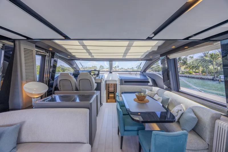Slide: The Image of Luxurious interior of 2023 Azimut S8 yacht with modern seating and panoramic windows. - 32