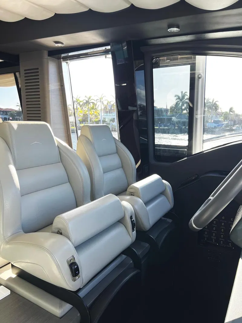 Slide: The Image of Interior of 2023 Azimut S8 yacht with luxurious white leather seats. - 42
