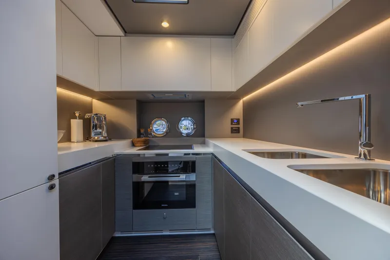 Slide: The Image of Modern kitchen interior of 2023 Azimut S8 yacht with sleek design and dual sinks. - 44