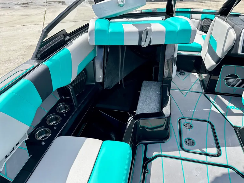 Slide: The Image of Interior of 2022 Malibu Wakesetter 23 LSV with turquoise seating. - 13