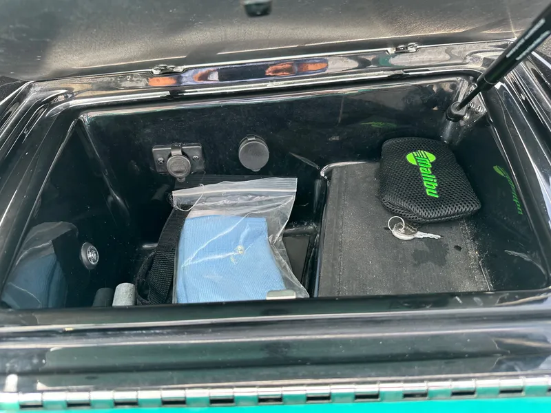 Slide: The Image of Storage compartment in 2022 Malibu Wakesetter 23 LSV with accessories. - 14
