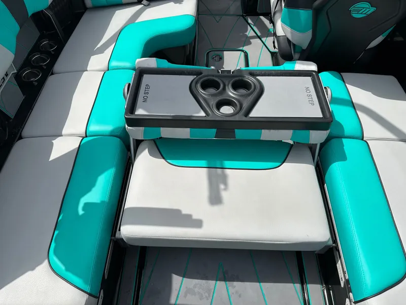 Slide: The Image of Interior of 2022 Malibu Wakesetter 23 LSV with turquoise seating. - 16