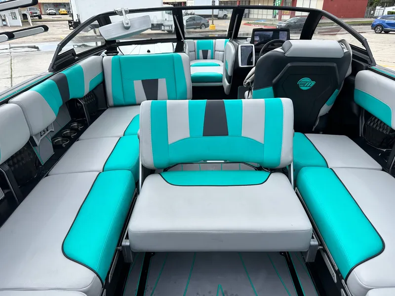 Slide: The Image of Interior of 2022 Malibu Wakesetter 23 LSV with turquoise seating. - 17