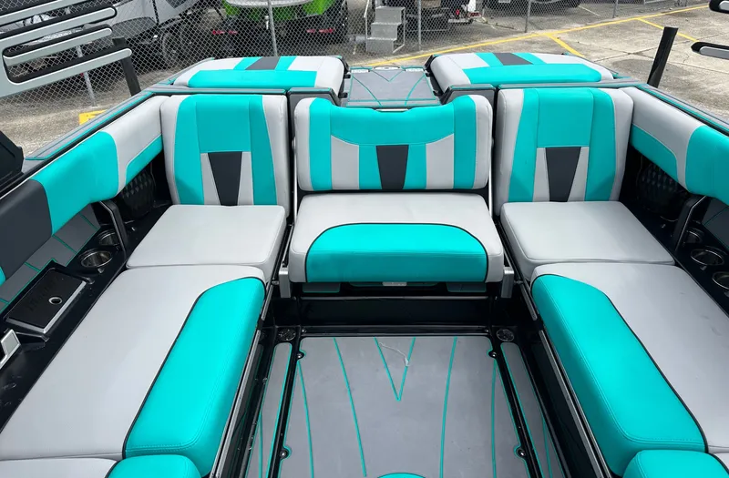 Slide: The Image of Interior of 2022 Malibu Wakesetter 23 LSV with turquoise seating. - 19