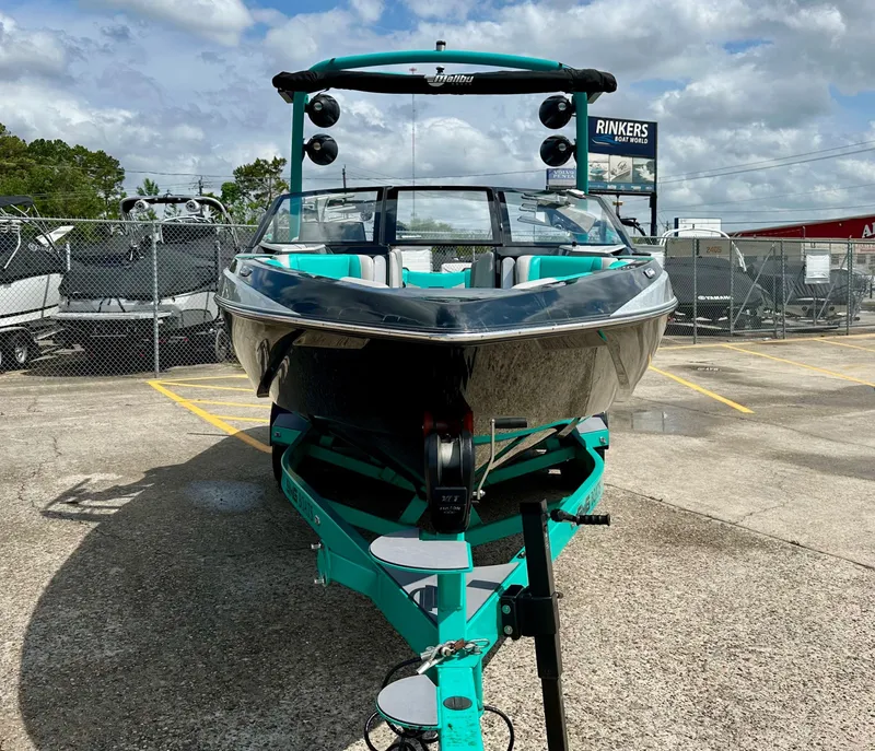 Slide: The Image of 2022 Malibu Wakesetter 23 LSV boat on trailer outdoors. - 4