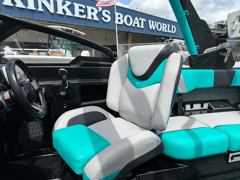 Slide: The Image of Interior of 2022 Malibu Wakesetter 23 LSV with turquoise seats. - 9