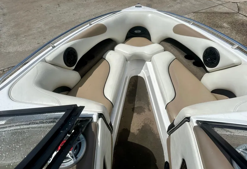Slide: The Image of Interior of a 2005 Malibu Sunscape 23 LSV boat with speakers. - 11