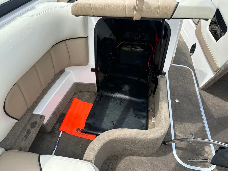 Slide: The Image of Interior of a 2005 Malibu Sunscape 23 LSV boat with open seat compartment. - 19