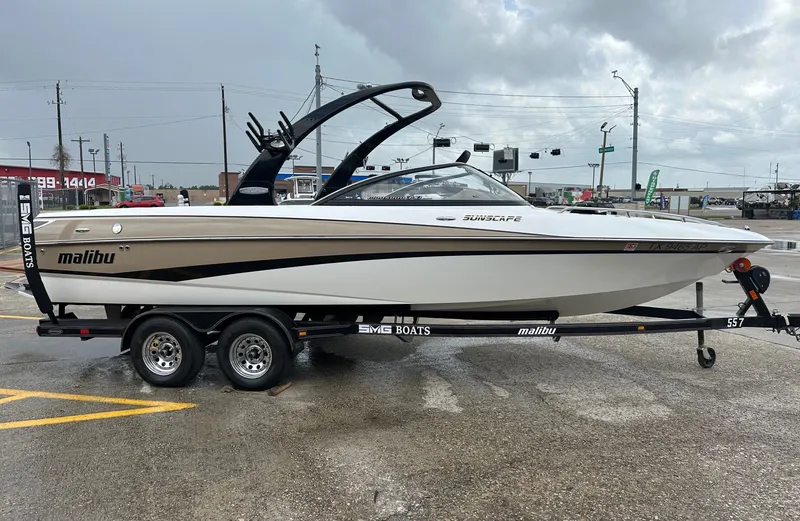 Slide: The Image of 2005 Malibu Sunscape 23 LSV boat on trailer, cloudy sky. - 2
