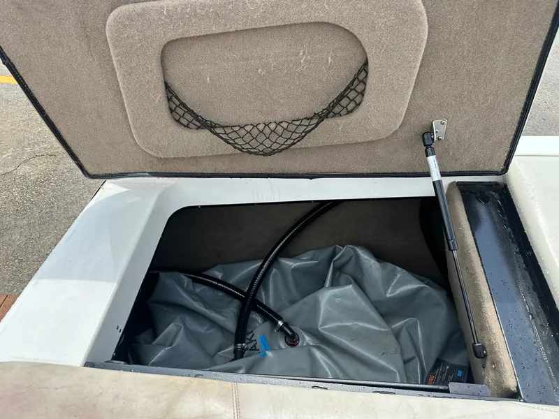 Slide: The Image of Storage compartment in 2005 Malibu Sunscape 23 LSV boat. - 22