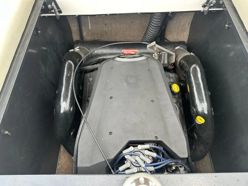 Slide: The Image of Engine compartment of a 2005 Malibu Sunscape 23 LSV boat. - 23