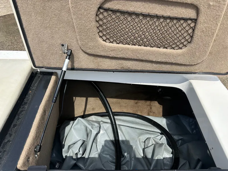 Slide: The Image of Storage compartment in 2005 Malibu Sunscape 23 LSV boat. - 24
