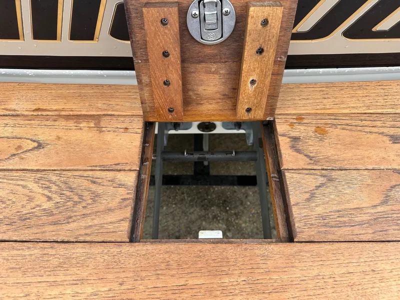 Slide: The Image of Wooden deck of a 2005 Malibu Sunscape 23 LSV boat with access hatch. - 7