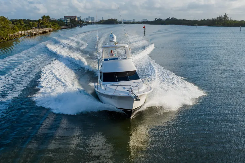 Slide: The Image of 2003 Wellcraft 400 Coastal yacht cruising on a scenic waterway. - 11