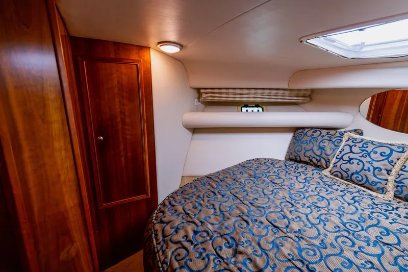 Slide: The Image of Luxurious cabin interior of 2003 Wellcraft 400 Coastal yacht with elegant bedding. - 111