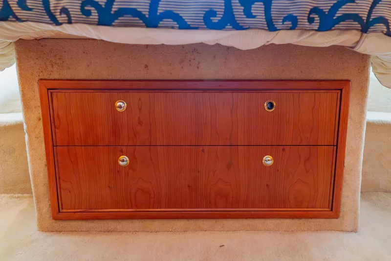 Slide: The Image of Wooden storage drawers in a 2003 Wellcraft 400 Coastal boat interior. - 115