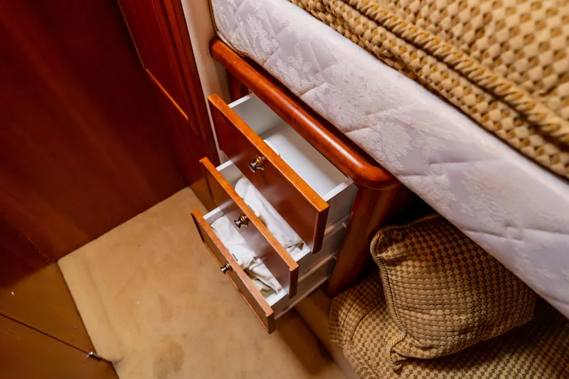 Slide: The Image of Wooden drawers beside bed in 2003 Wellcraft 400 Coastal yacht interior. - 120
