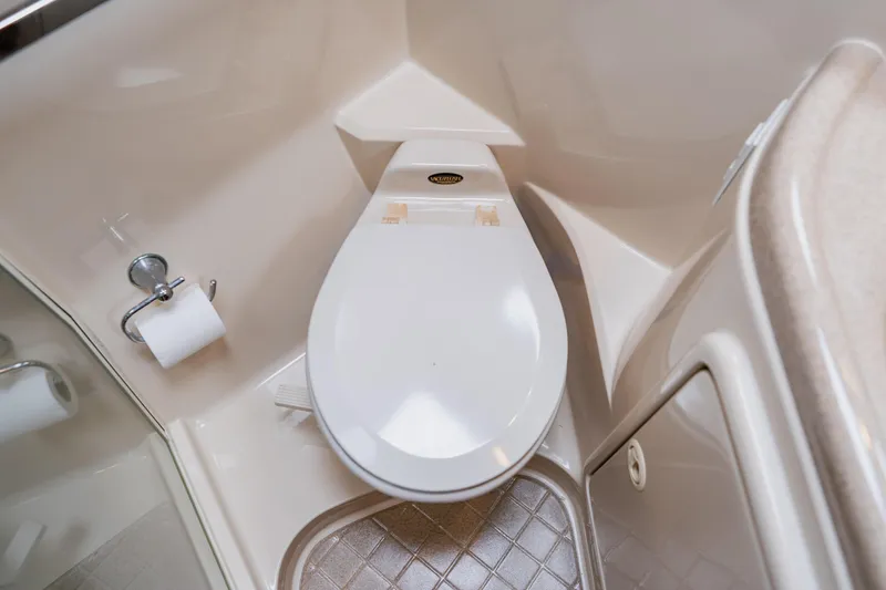 Slide: The Image of 2003 Wellcraft 400 Coastal boat bathroom with toilet and toilet paper holder. - 125