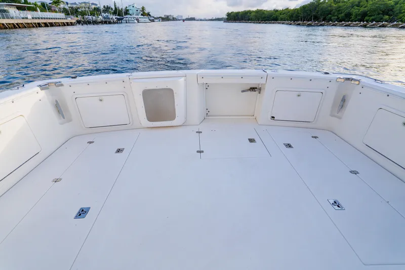 Slide: The Image of Spacious deck of 2003 Wellcraft 400 Coastal boat, overlooking serene waterway. - 15