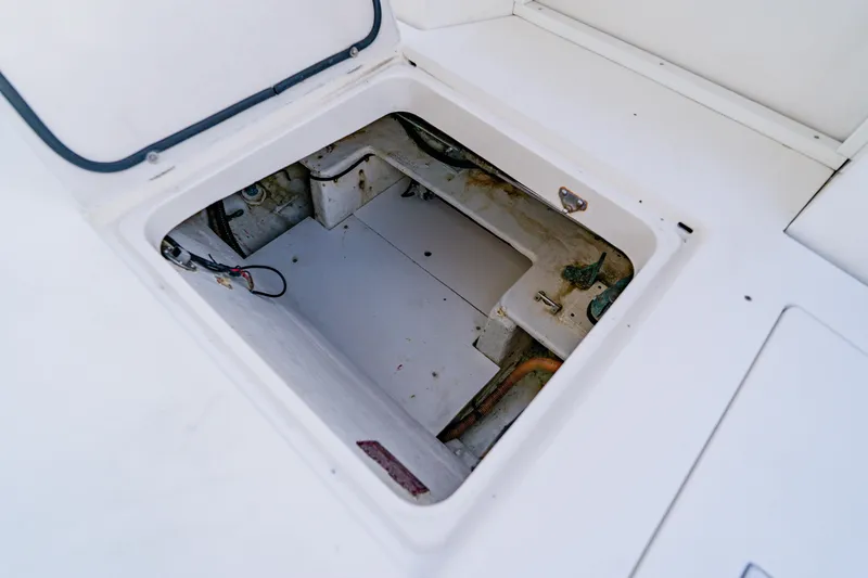 Slide: The Image of Open hatch on 2003 Wellcraft 400 Coastal boat, revealing storage compartment. - 19