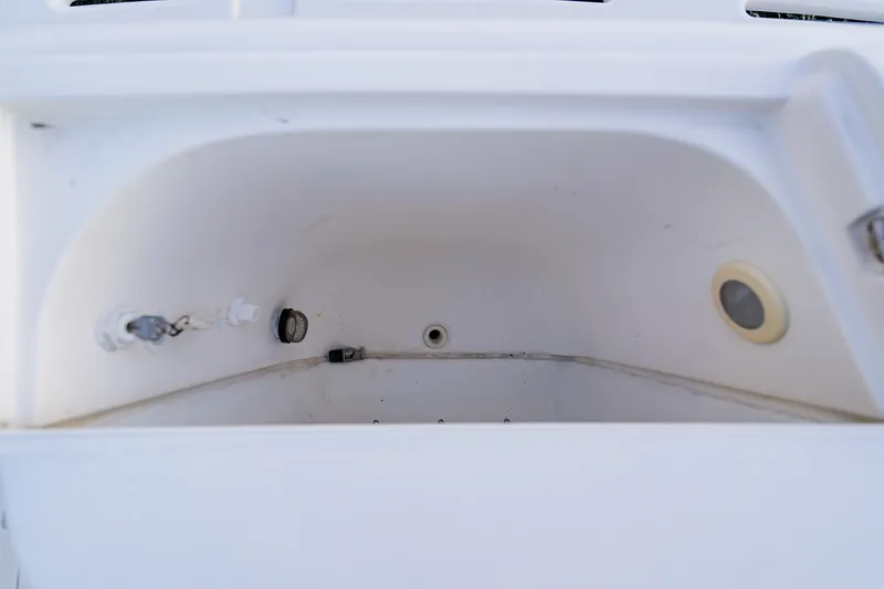 Slide: The Image of Empty storage compartment on a 2003 Wellcraft 400 Coastal boat. - 23