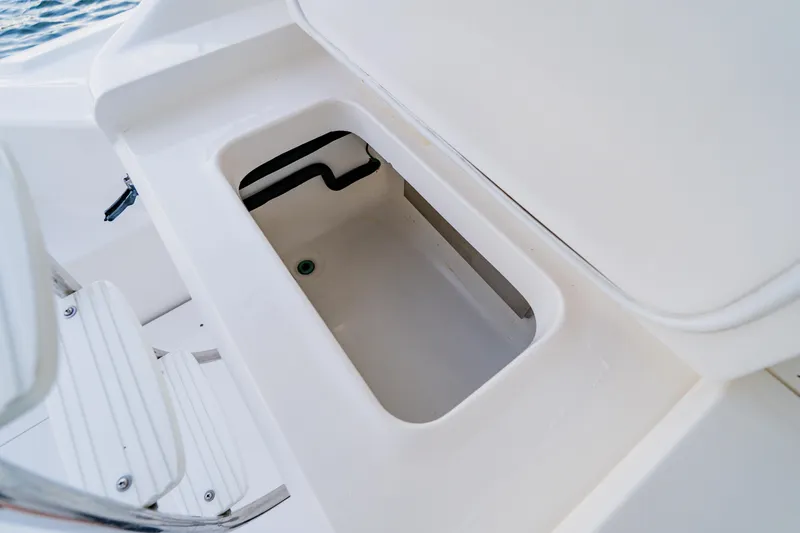 Slide: The Image of Open storage compartment on 2003 Wellcraft 400 Coastal boat deck. - 28