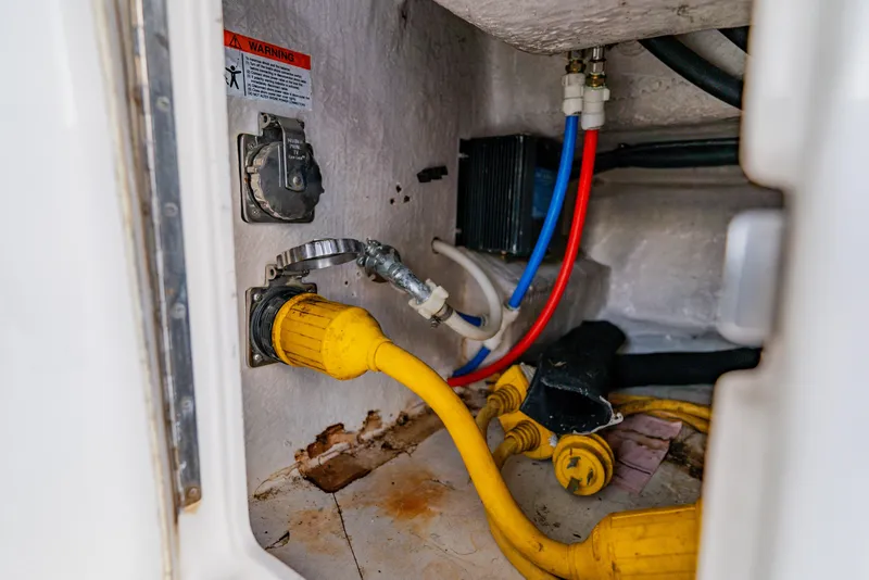 Slide: The Image of Electrical connections and wiring inside a 2003 Wellcraft 400 Coastal boat. - 30