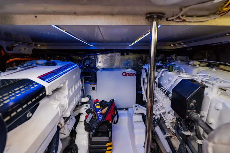 Slide: The Image of Engine room of a 2003 Wellcraft 400 Coastal boat with visible machinery and equipment. - 32