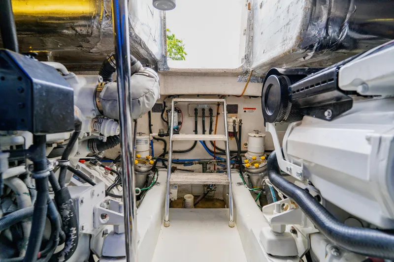 Slide: The Image of Engine room of 2003 Wellcraft 400 Coastal boat, showcasing mechanical components and systems. - 33