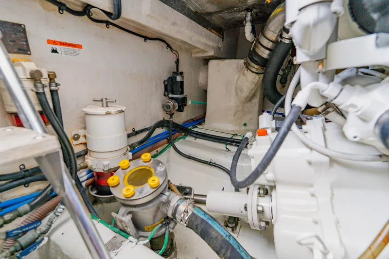 Slide: The Image of Engine room of 2003 Wellcraft 400 Coastal boat with visible machinery and wiring. - 34