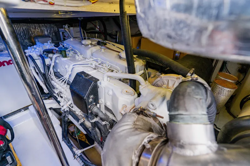 Slide: The Image of Engine room of a 2003 Wellcraft 400 Coastal boat, showcasing detailed machinery. - 37