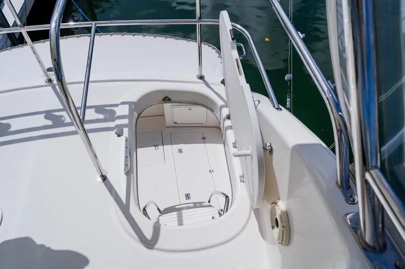 Slide: The Image of Deck view of 2003 Wellcraft 400 Coastal boat with open hatch and railing. - 45