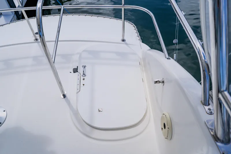 Slide: The Image of 2003 Wellcraft 400 Coastal boat deck with stainless steel railings and hatch. - 46