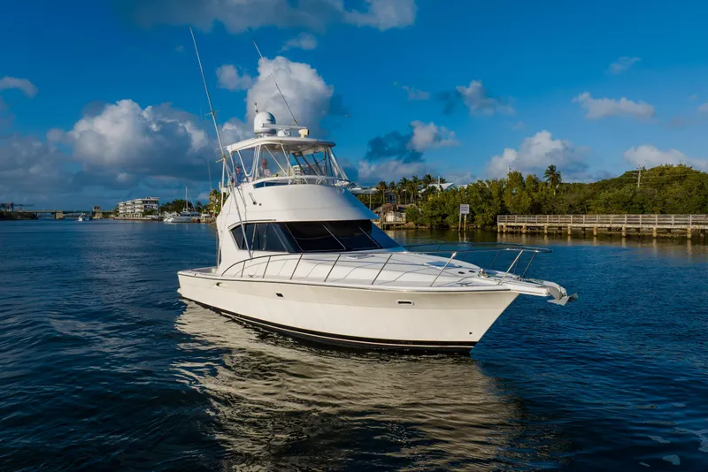 Slide: The Image of 2003 Wellcraft 400 Coastal yacht cruising on a sunny day with blue skies. - 5