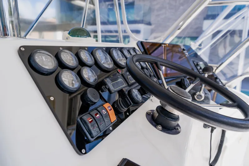 Slide: The Image of Control panel of 2003 Wellcraft 400 Coastal boat with steering wheel and gauges. - 52