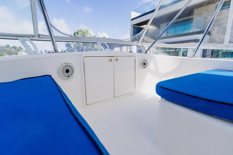 Slide: The Image of Interior view of 2003 Wellcraft 400 Coastal boat with blue seating and storage compartment. - 56