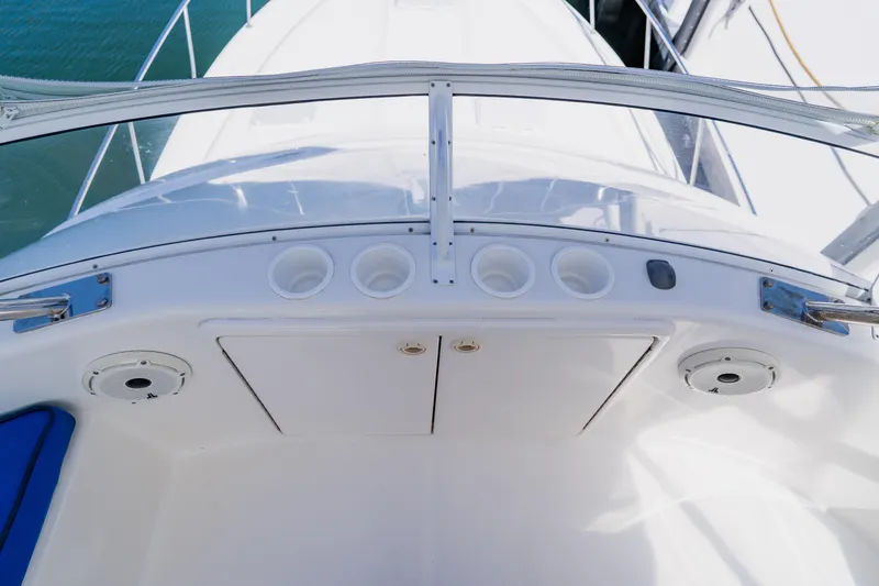 Slide: The Image of 2003 Wellcraft 400 Coastal boat deck with cup holders and storage compartments. - 57