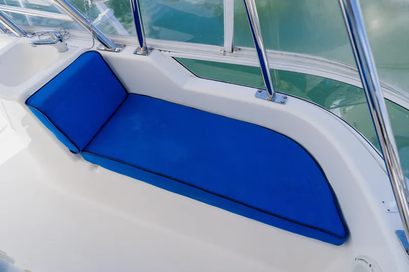Slide: The Image of Blue cushioned seating on 2003 Wellcraft 400 Coastal boat deck. - 60
