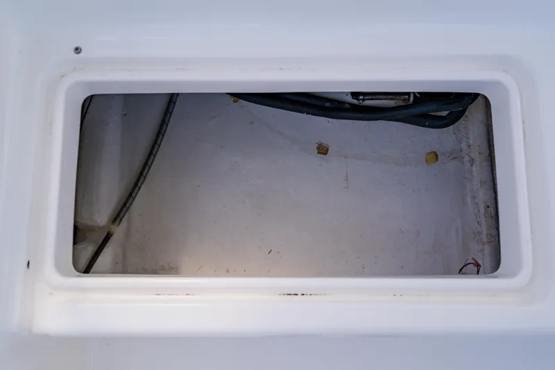 Slide: The Image of Storage compartment of a 2003 Wellcraft 400 Coastal boat, showing interior details. - 62